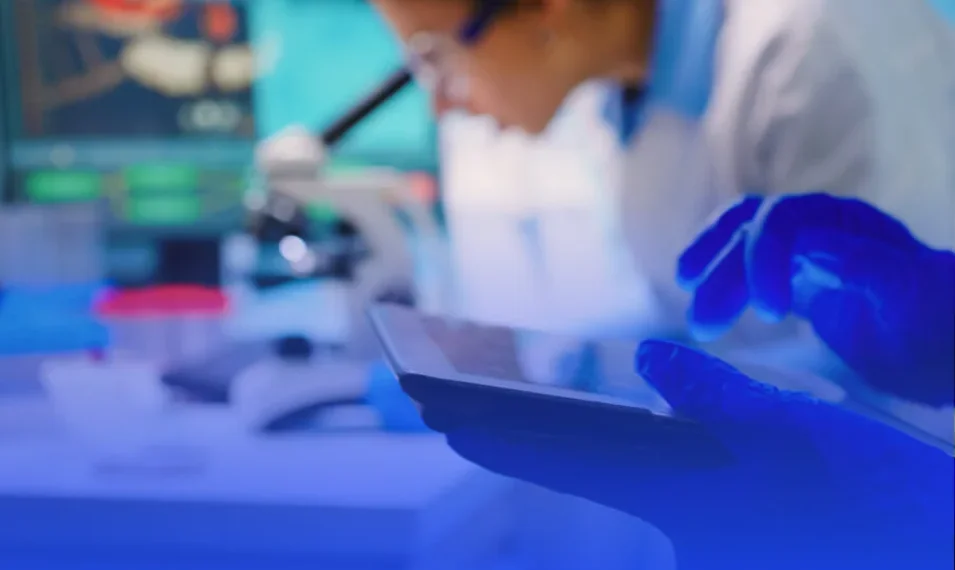 lab technicians using a tablet