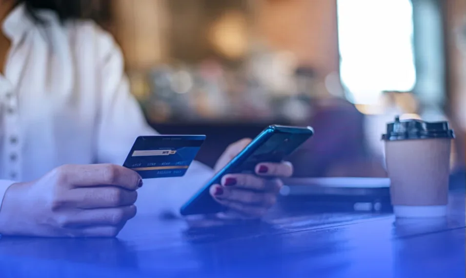 woman on mobile making credit card payment