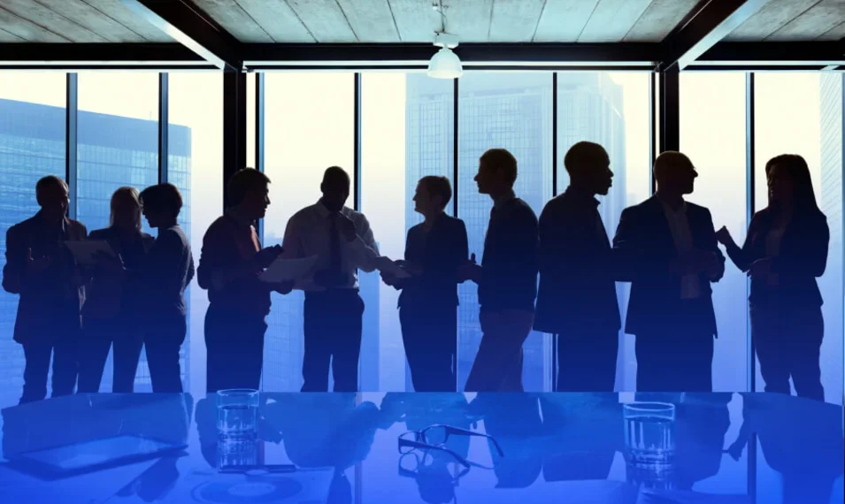 people standing in board room